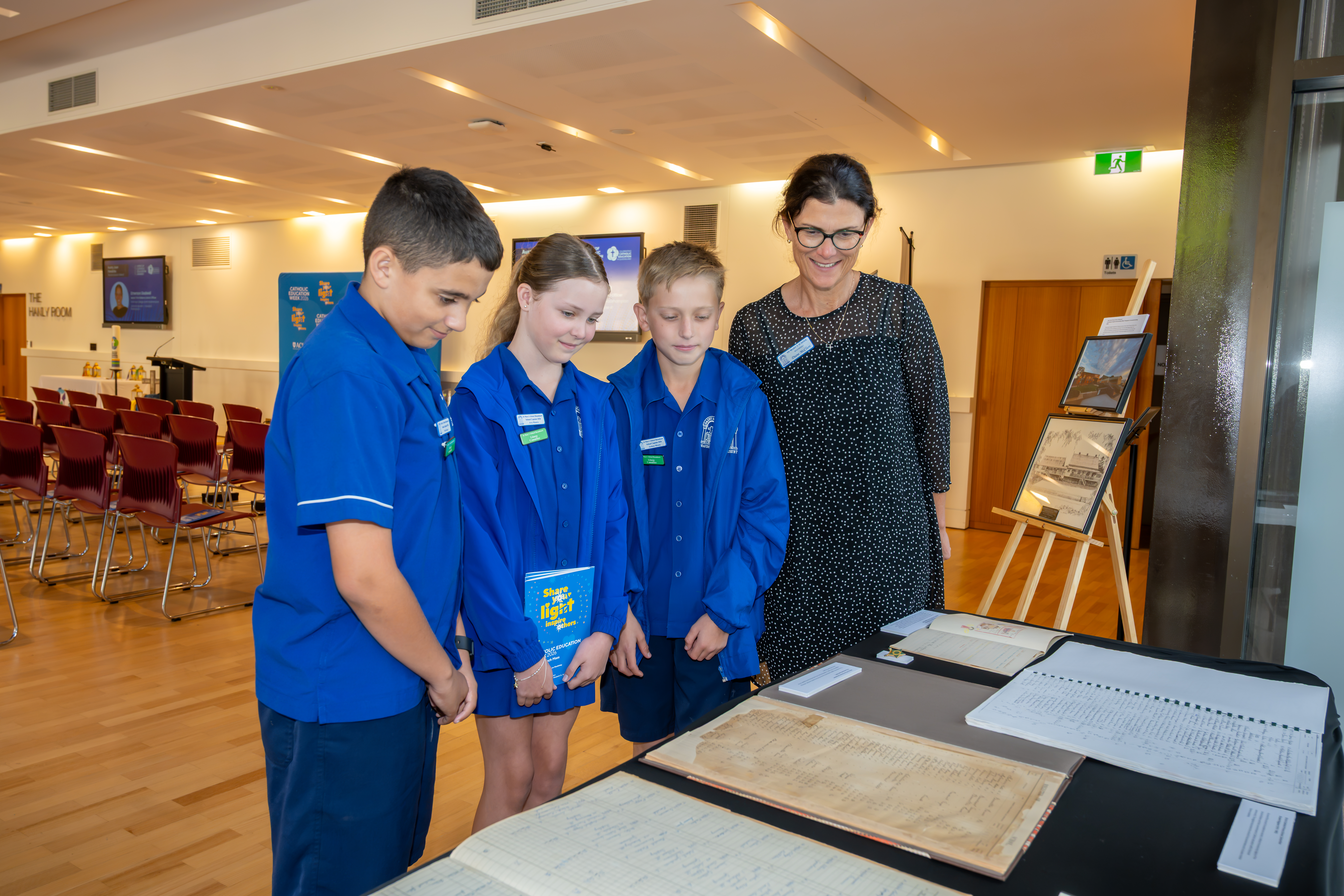 St Mary's Primary School, Beaudesert students looking at BCE's School of Origin Exhibition 