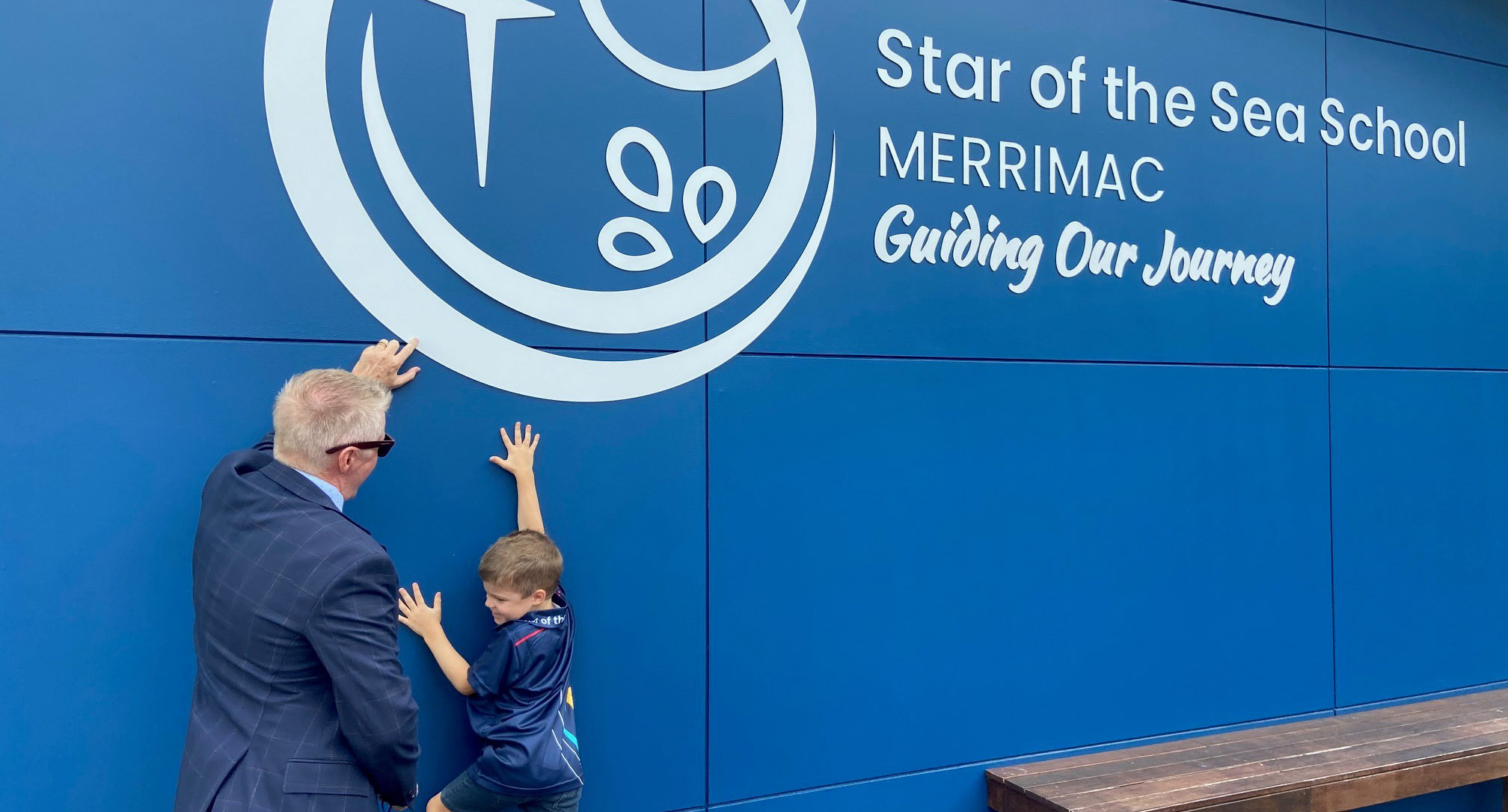 Peyton with Principal Tony Barron outside Star of the Sea's new sign_web.jpg