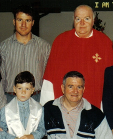 Jason’s first communion 1996 with David Wrafter, Father McCarthy, Jason and Tony Wrafter..png